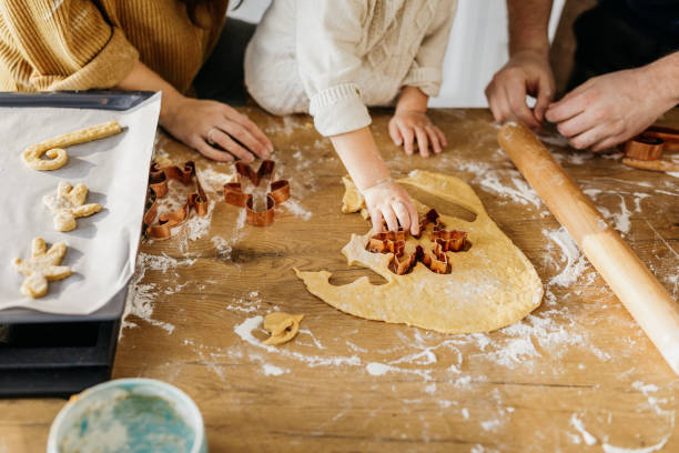 istock Young family baking cookies 1215364358