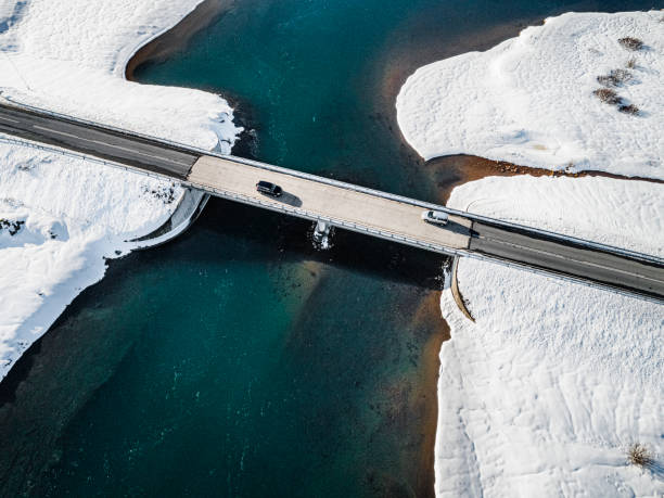 istock Bridge over river in beautiful white snow 1215367979
