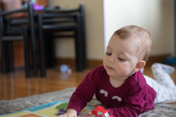 istock Baby girl crawling 1215368021