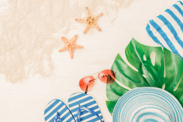 istock Flat lay composition with a summer hat and flip flops on a light background 1215368055