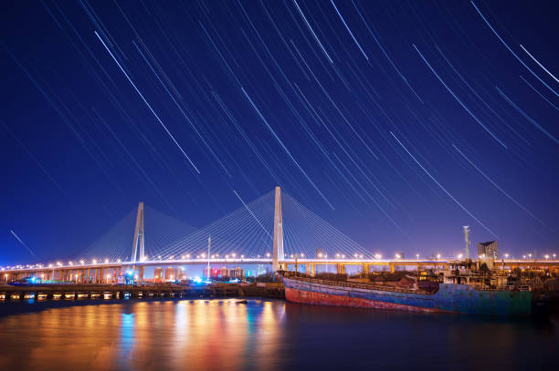 istock Star track over cable stayed bridge, Haihe Bridge, Tianjin, China 1215369643