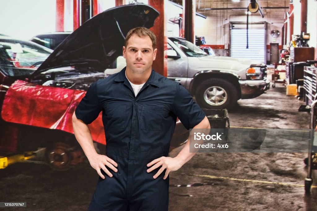 Caucasian Young Male Manual Worker Repairing At The Auto Repair Shop ... - Caucasian Young Male Manual Worker Repairing At The Auto Repair Shop Wearing Coveralls Caucasian Young Male Manual Worker Repairing At The Auto Repair Shop ... - Caucasian Young Male Manual Worker Repairing At The Auto Repair Shop Wearing Coveralls