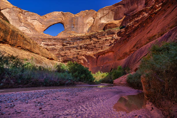Stevens Arch Escalante Stevens Arch Escalante - Landscape scenic of spectacular arch in the canyons of the Escalante River. escalante stock pictures, royalty-free photos & images