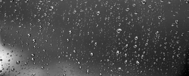 istock Water drops on glass. Dark background. 1215372199