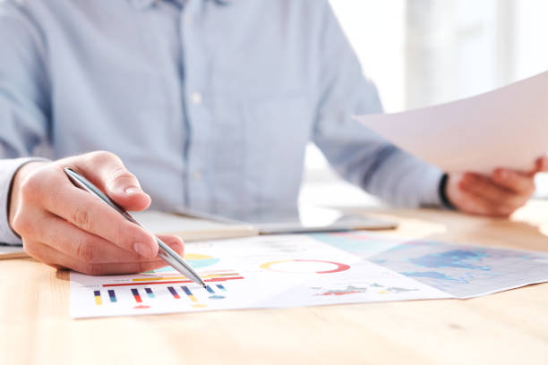 istock Discussing business charts in office 1215372273
