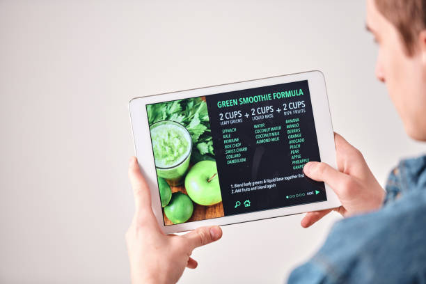 istock Reading green smoothie recipe 1215373742