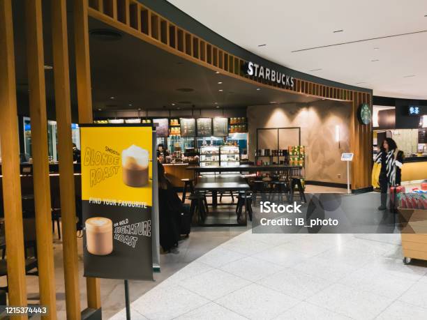 A Starbucks Coffee Cafe Inside The Departure Hall Of Athens International Airport Eleftherios Venizelos Starbucks Corporation Is An American Coffee Company And Coffeehouse Chain Stock Photo - Download Image Now