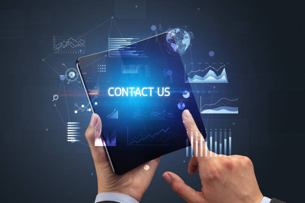 istock Businessman holding a foldable smartphone, business concept 1215376518
