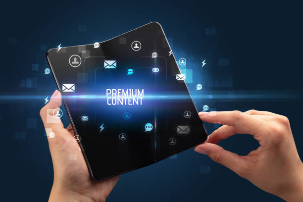 istock Businessman holding a foldable smartphone, social media concept 1215376567
