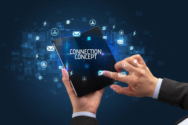 istock Businessman holding a foldable smartphone, social media concept 1215376614