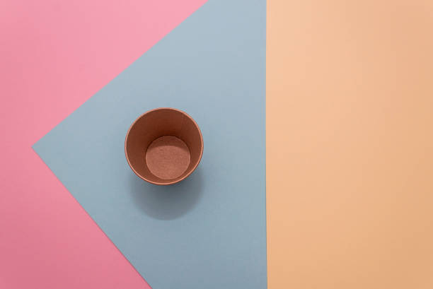 istock One craft paper cup for coffee on a  yellow  background 1215376915