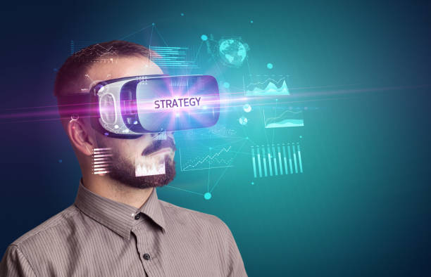 istock Businessman looking through Virtual Reality glasses 1215376968