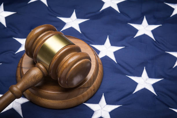 Gavel on American flag, close up Gavel on American flag, close up judge law stock pictures, royalty-free photos & images