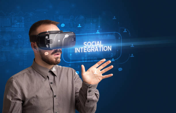 istock Businessman looking through Virtual Reality glasses, social media concept 1215377783