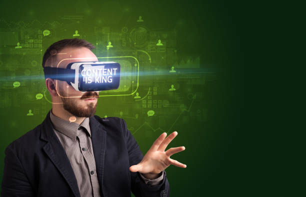 istock Businessman looking through Virtual Reality glasses, social media concept 1215377843