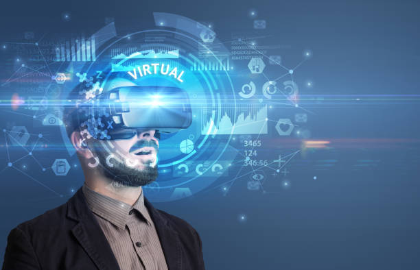 istock Businessman looking through VR glasses 1215377975