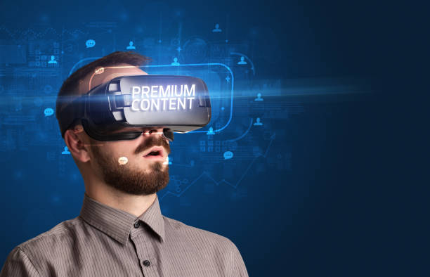 istock Businessman looking through Virtual Reality glasses, social media concept 1215378065