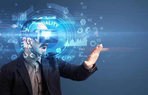 istock Businessman looking through VR glasses 1215378137