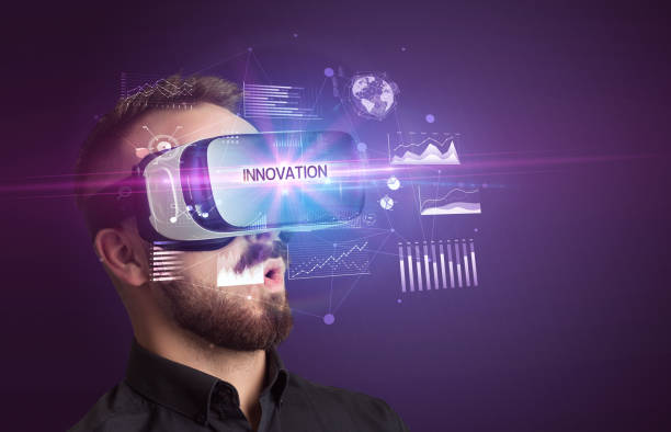 istock Businessman looking through Virtual Reality glasses 1215378218