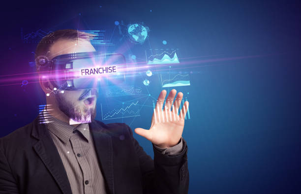 istock Businessman looking through Virtual Reality glasses 1215378430