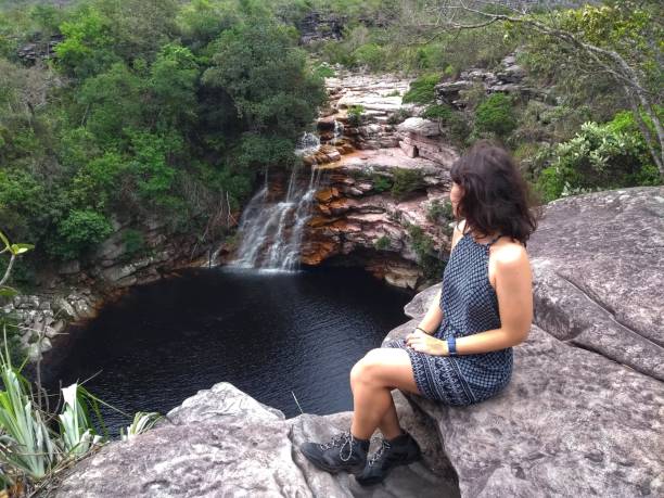 Girl at Poço do Diabo - Waterfall - Chapada Diamantina, Bahia, Brazil stock photo