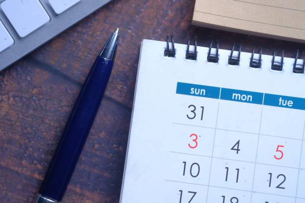 istock top view of calendar, pen on white background 1215381098
