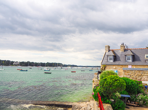 In May 2018, tourists could enjoy a walk on the coastline during a sunny day in springtime in L'ile Tudy, Brittany, France