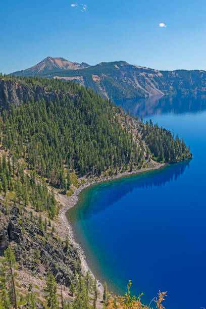 istock Forested Ridges Along an Alpine Lake 1215385085