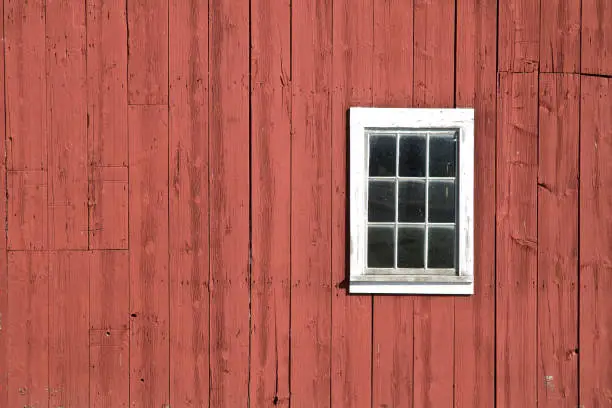 Photo of Red barn siding with small window, background