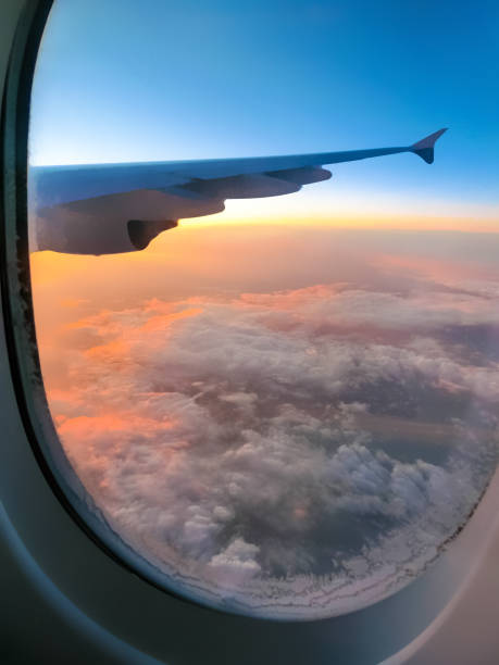 istock View from an airplane on a blue sky and white clouds. 1215386728
