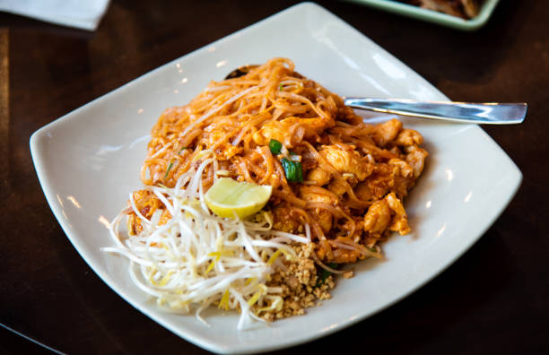 traditional Thai food pad Thai serviced on a plate on the table