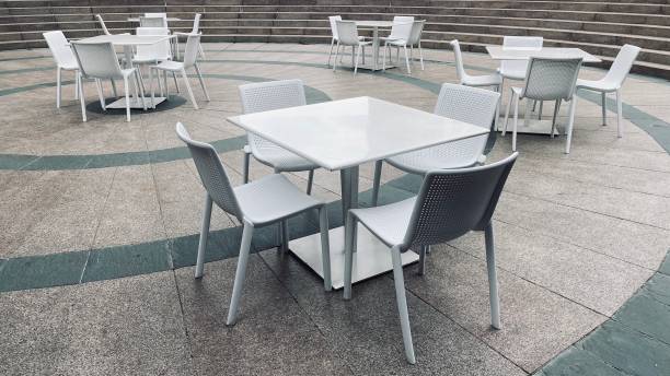 istock Empty white chairs and tables in Downtown LA during virus quarantine 1215387379