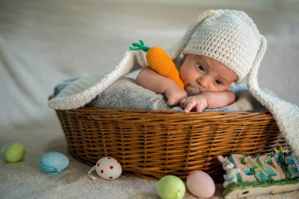 istock baby Easter bunny in basket with eggs 1215388703