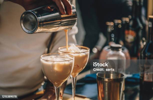 Bartender Preparing Irish Cream Liqueur Cocktail With Shaker Stock Photo - Download Image Now