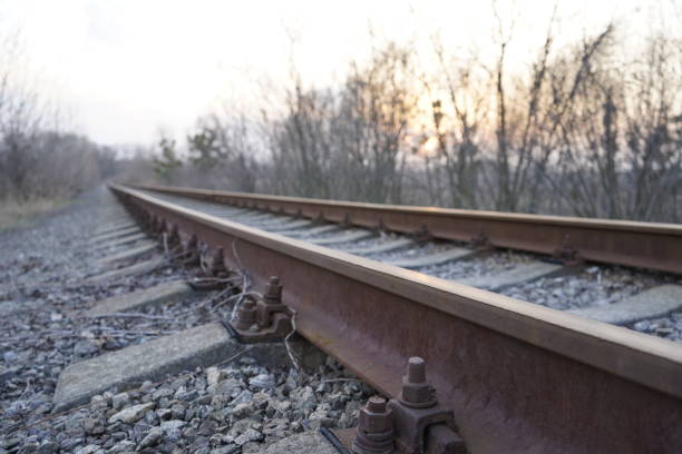 istock Railroad track, rails and railway sleepers. 1215390355