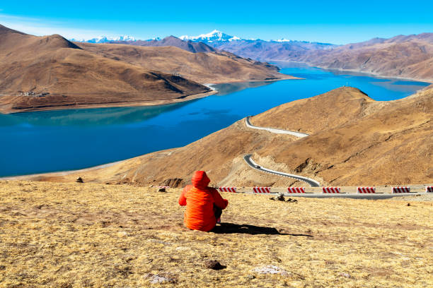 istock Female Hiker Sitting on Mountain 1215391153
