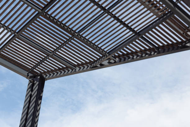 istock Background of large urban shade structure, blue sky and clouds copy space 1215392688