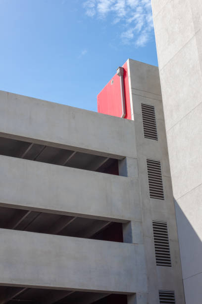 istock Modern architecture stucco parking garage, sunny day with blue sky 1215392697