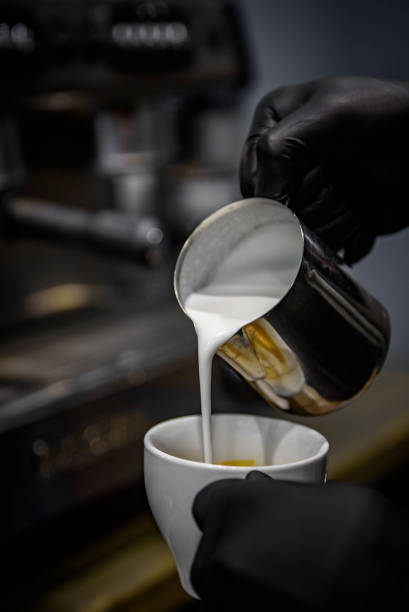 istock Barista hand making cappuccino Coffee with espresso machine in cafe 1215393930