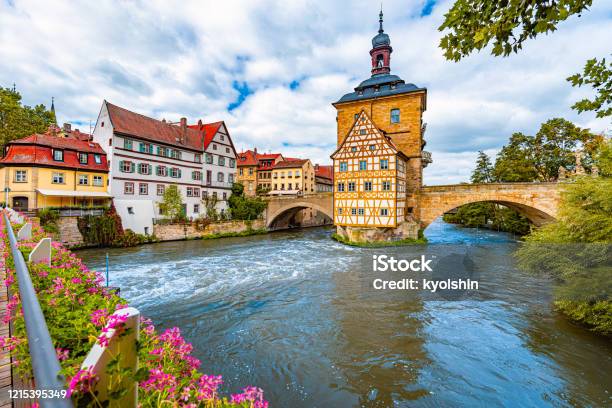 Bamberg City In Germany Town Hall Building In Background With Blue Cloudy Sky Architecture And Travel In Europe Flowing River In Foreground Stock Photo - Download Image Now