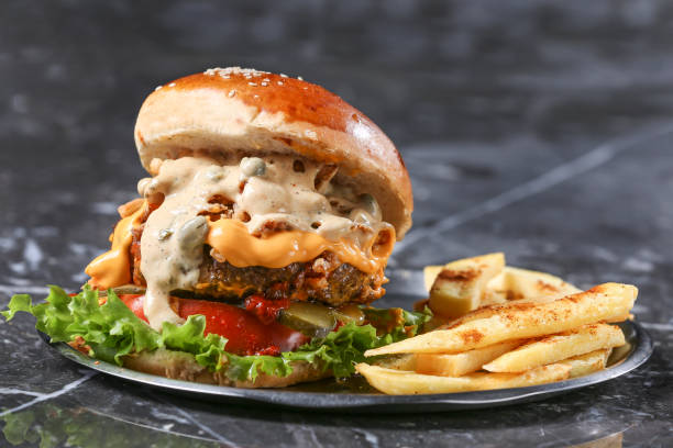 istock Homemade Hamburger on marble Background 1215398665