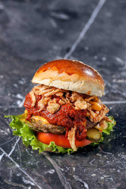 istock Homemade Hamburger on marble Background 1215398666