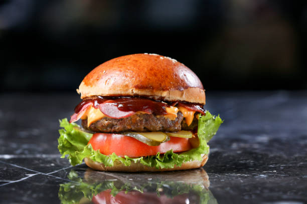 istock Homemade Hamburger on marble Background 1215398729