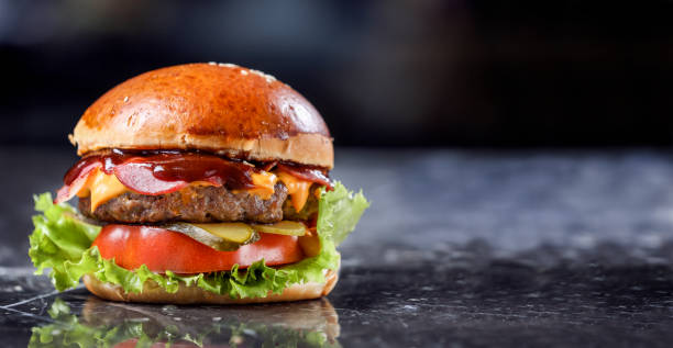 istock Homemade Hamburger on marble Background 1215398742