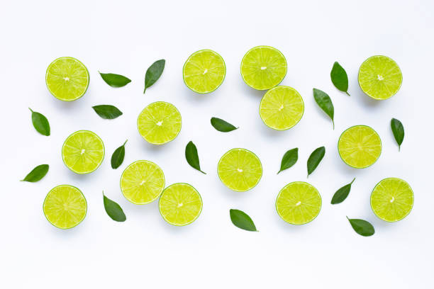 istock Limes with leaves isolated on white. 1215400363