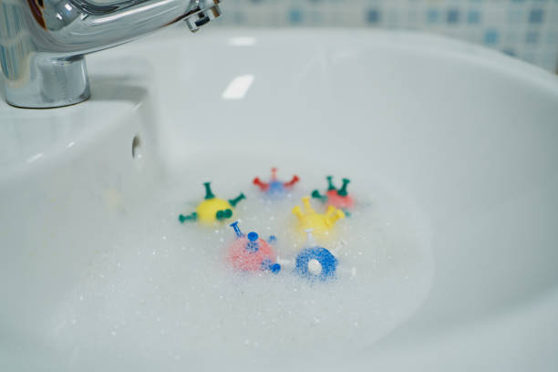 istock models of coronavirus in soapy washroom water 1215402562