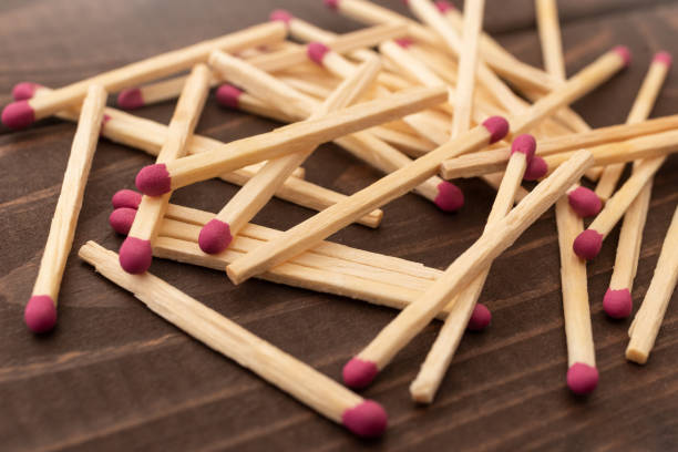 istock Matches on a white isolated background. Matches on a wooden background. Matches. 1215402780
