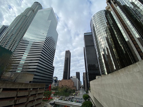 LOS ANGELES, CA, MAR 2020: view south along Flower St, flanked by skyscrapers and office buildings, in Downtown
