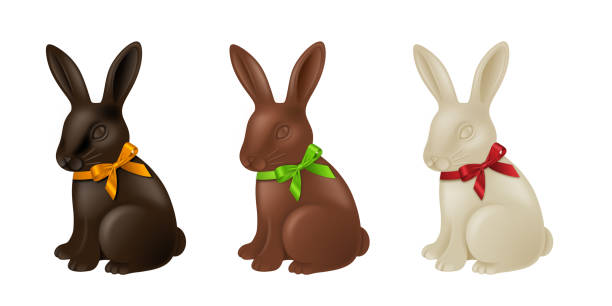Set of chocolate Easter rabbits with colorful bows. Dark, milk and white chocolate bunnies Set of chocolate Easter rabbits with colorful bows. Dark, milk and white chocolate bunnies vector chocolate bunny stock illustrations