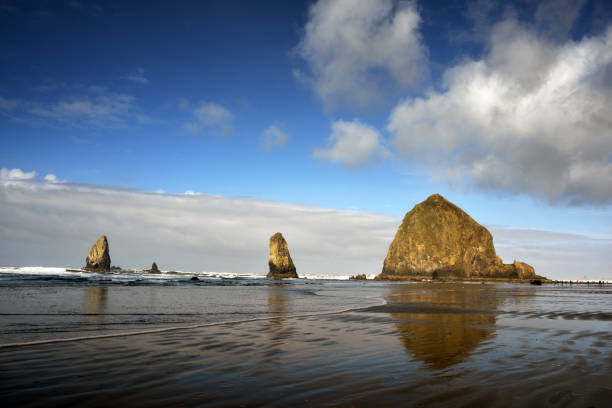 istock Haystack Rock Cannon at Beach, Oregon with Reflection, Taken in Winter 1215404910